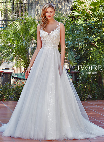 Fitted lace silhouette bridal gown. Fitted roping adorns the curved V-back.